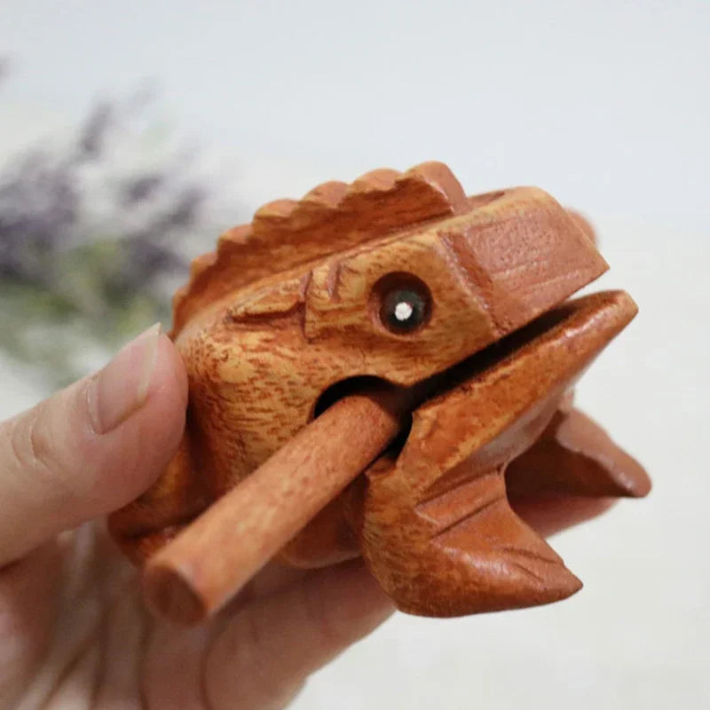 Hand-carved wooden lucky frog croaking musical instrument with natural finish and black bead eye for decor and gifts