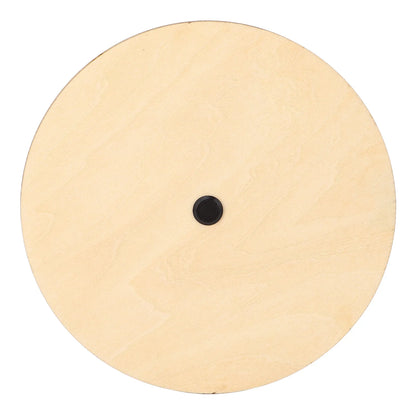 Light-colored circular wooden melody tool with small black center for guitar chord and music theory use