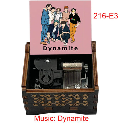 Wooden mechanical music box with engraved leaf pattern and pink lid featuring dynamite illustration for friends home decoration