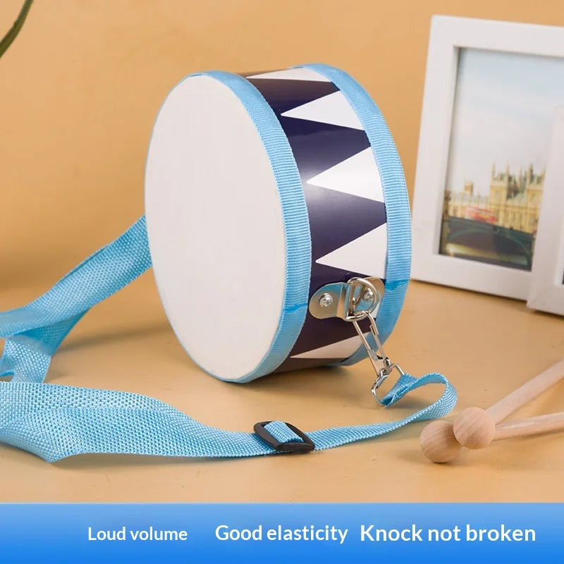 Wooden percussion drum toy for toddlers with blue and white pattern and light blue carrying strap for rhythm development