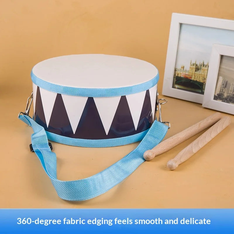 Wooden percussion drum toy for toddlers with white head navy blue patterned body light blue strap for rhythm development