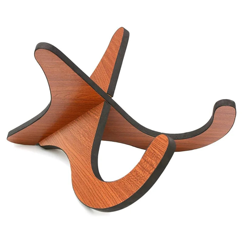 A sleek wooden ukelele stand with a warm reddish-brown finish and black-edged curves for concert instrument use