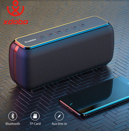 Black textured xdobo x8 60w wireless bass subwoofer with gold and red accents and tws function control buttons on top