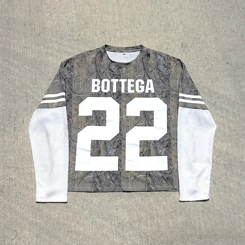 Back view of gray camouflage long-sleeve jersey with white mesh sleeves and bold white bottega 22 print for casual wear