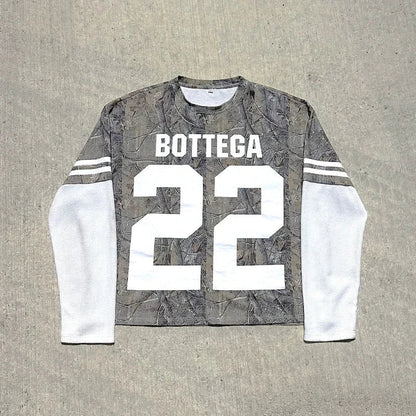 Back view of gray camouflage long-sleeve jersey with white mesh sleeves and bold white bottega 22 print for casual wear