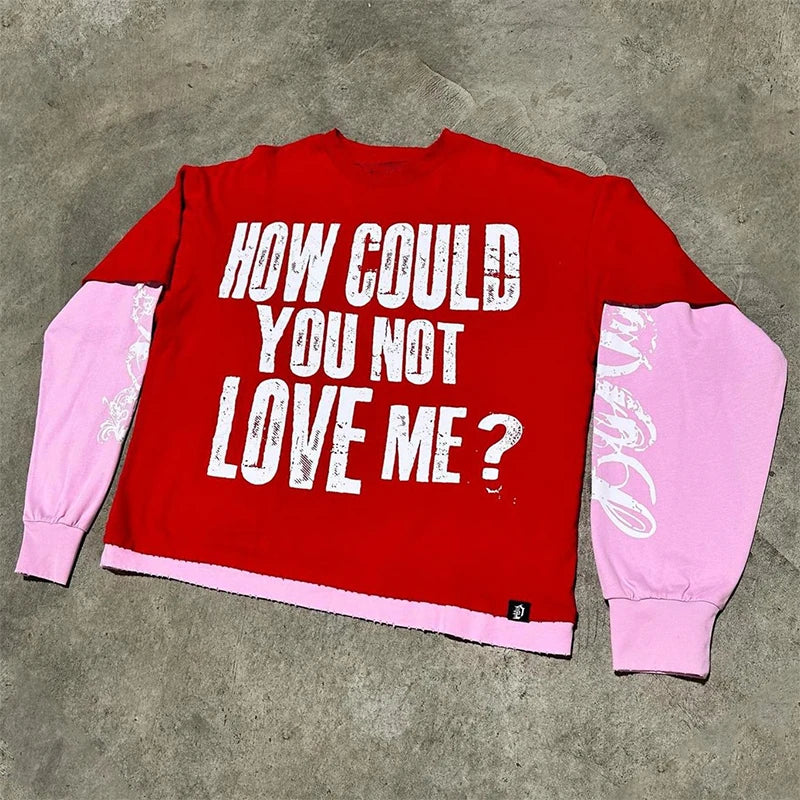 Back view of red and pink color-blocked y2k printed graphic hoodie with white distressed text on sweatshirt