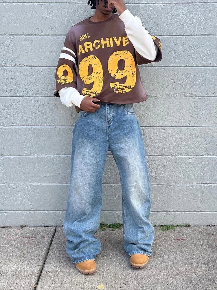 Brown oversized sweatshirt with yellow archive 99 graphic and white sleeve stripes in a casual hip hop style