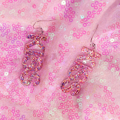 Pink glittery resin y2k earrings shaped like bars with glossy finish and metallic hooks from cute flame snake set