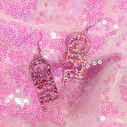 Pink glittery bff y2k earrings with translucent resin finish perfect for cute flame snake lightning queen alien style
