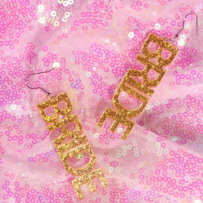 Gold glitter bride letter drop earrings featuring y2k earrings with cute flame snake and lightning queen alien elements