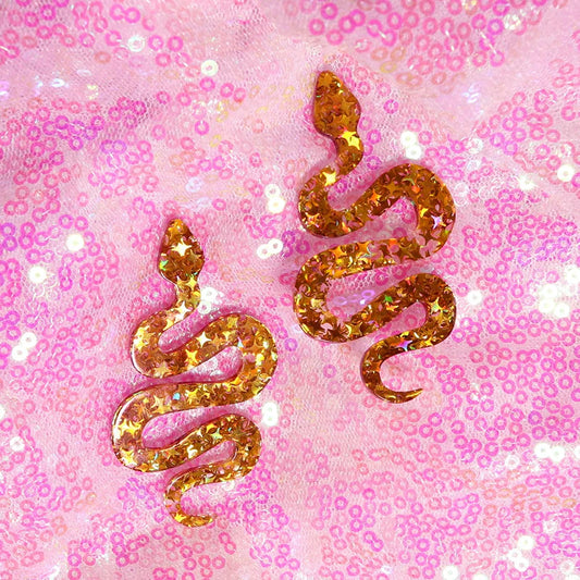 Golden glittery y2k earrings shaped like a cute flame snake with a shiny starry texture for lightning queen alien style