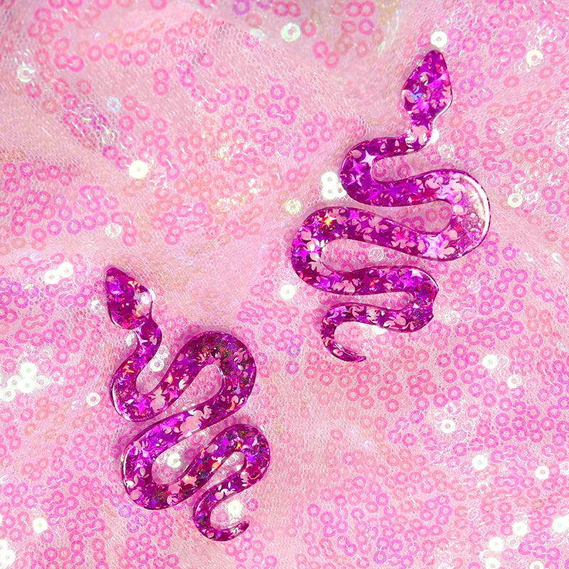 Two vibrant purple glitter resin y2k earrings featuring cute flame snake design with star sparkles for lightning queen alien style
