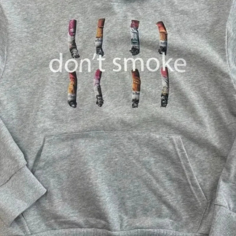 Y2k gray sports hoodie featuring a retro smoke print with graphic cigarette butts and dont smoke text for vintage classic fashion