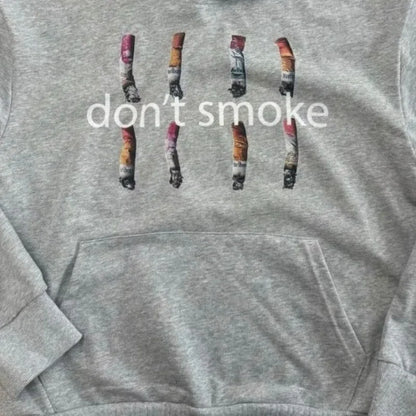 Y2k gray sports hoodie featuring a retro smoke print with graphic cigarette butts and dont smoke text for vintage classic fashion
