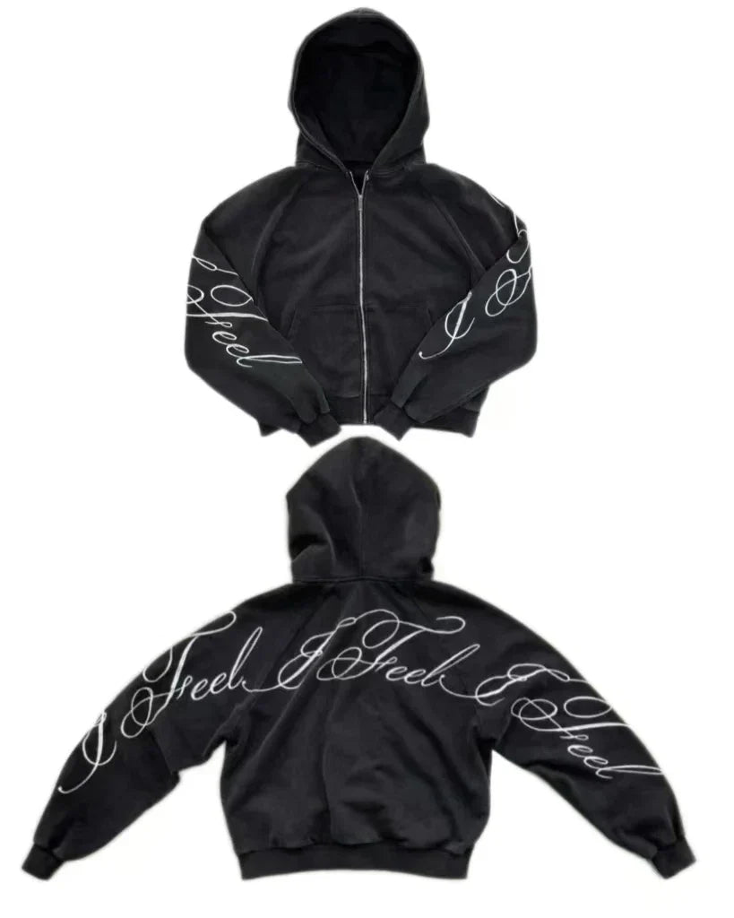 Black oversized zipper sweatshirt with white cursive i feel embroidery on sleeves and back in y2k harajuku gothic style