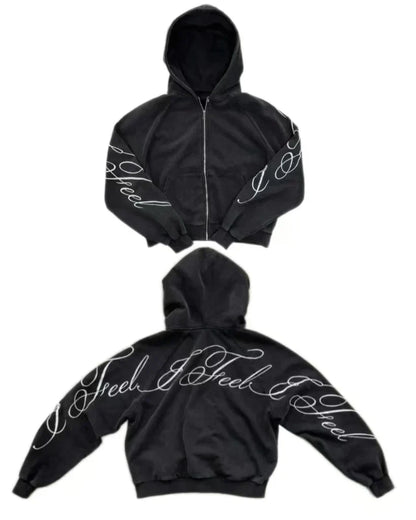 Black oversized zipper sweatshirt with white cursive i feel embroidery on sleeves and back in y2k harajuku gothic style