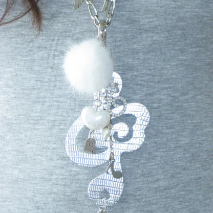 Silver metallic keychain with textured music note design, fluffy pom-pom, and heart charms for women harajuku kawaii fashion