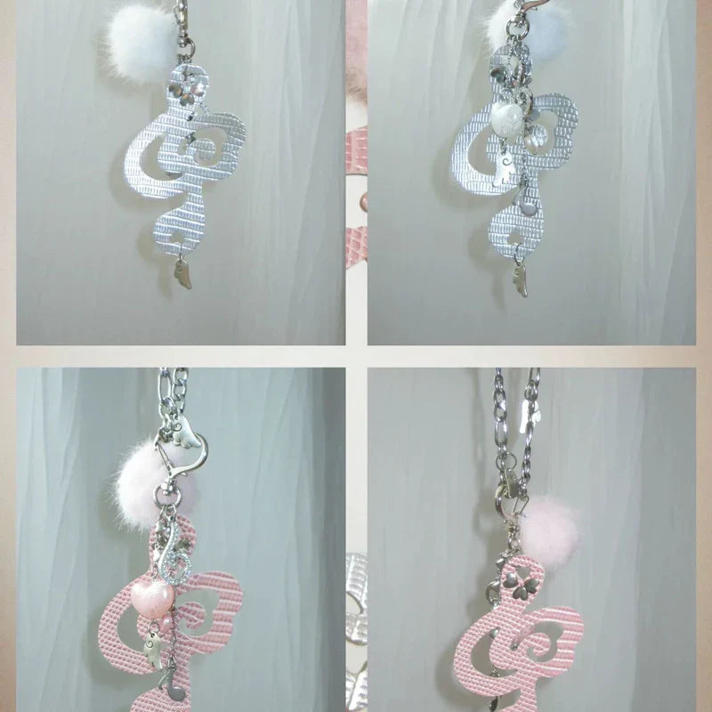 Silver and pink jewelry musical notes keychains with textured surfaces pom-poms and crystal accents for women harajuku kawaii