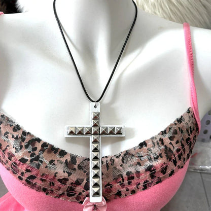 Studded silver cross necklace with black cord featuring wooden cross rivet design for y2k jewelry hip hop grunge style