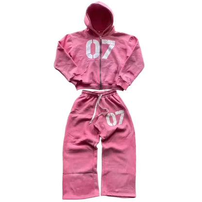 Pink cropped hoodie and matching sweatpants set with white 07 numerals in casual baggy spring streetwear style