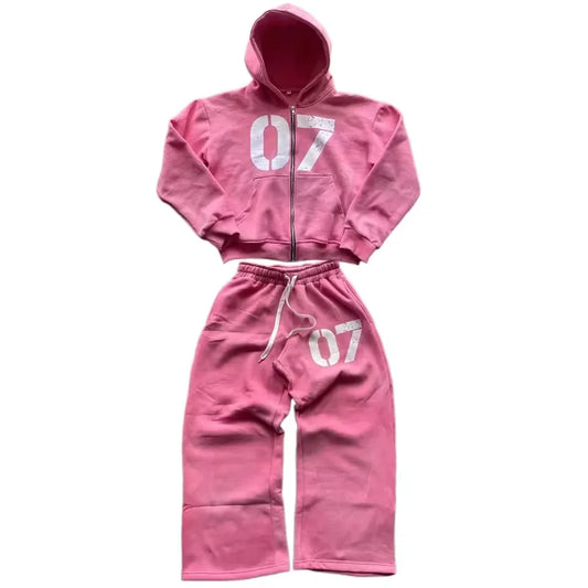 Pink cropped hoodie and matching sweatpants set with white 07 numerals in casual baggy spring streetwear style