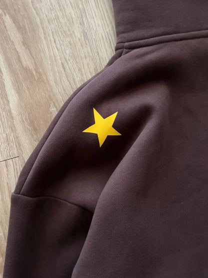 A bright yellow star patch on a dark brown fleece hoodie from y2k stands hiphop japanese jojo hoodies harajuku collection