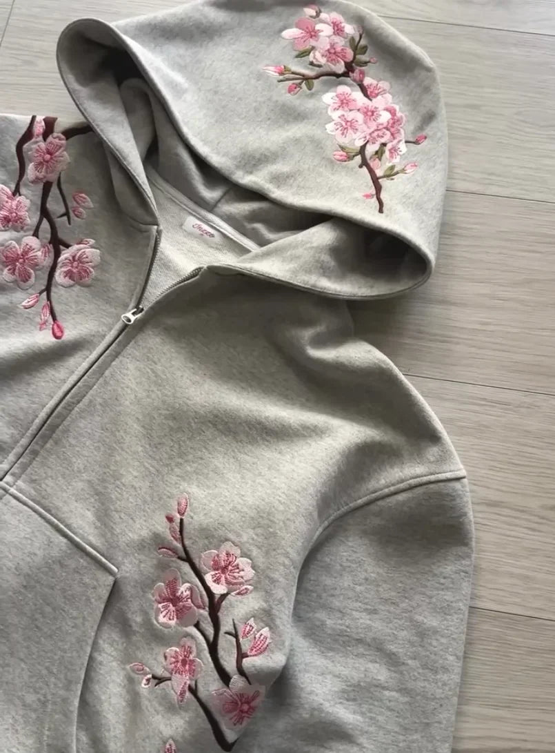 A soft gray y2k vintage oversized embroidered hooded jacket with pink cherry blossom embroidery on sleeves and front