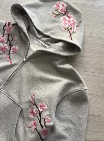 A soft gray y2k vintage oversized embroidered hooded jacket with pink cherry blossom embroidery on sleeves and front