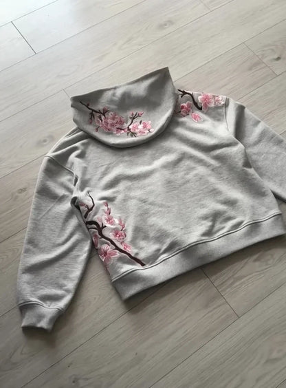 A soft gray y2k vintage oversized embroidered hooded jacket with pink cherry blossom details on collar and sleeves