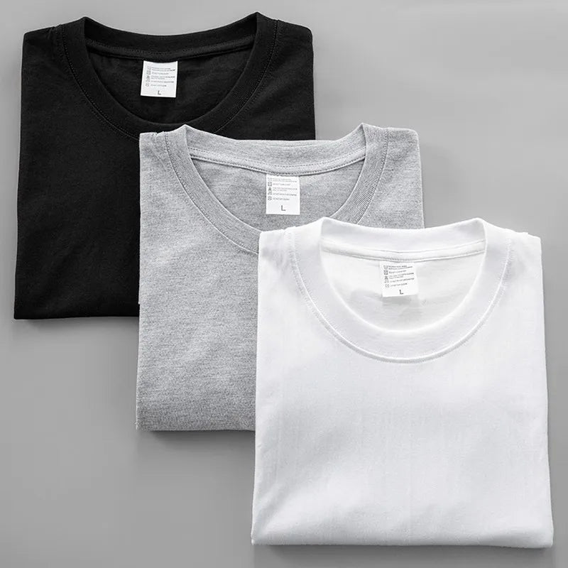 Three neatly folded Yeat 2026 album ADL graphic crew neck t-shirts in black heather gray and white cotton for summer