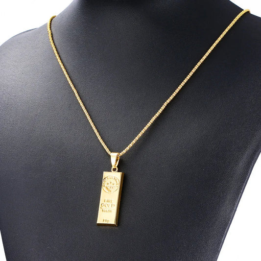 Yellow gold plated hip hop necklace with gold bar bullion pendant and engraved markings on matching chain for men women