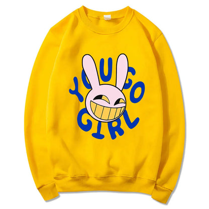 Bright yellow crewneck sweatshirt with cartoon bunny and bold blue yugo girl text digital circus jax rabbit hoodie unisex