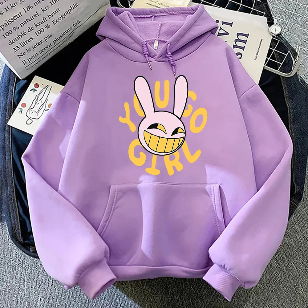A soft lavender digital circus jax rabbit hoodie unisex with a bold yellow young girl graphic and smiling bunny design