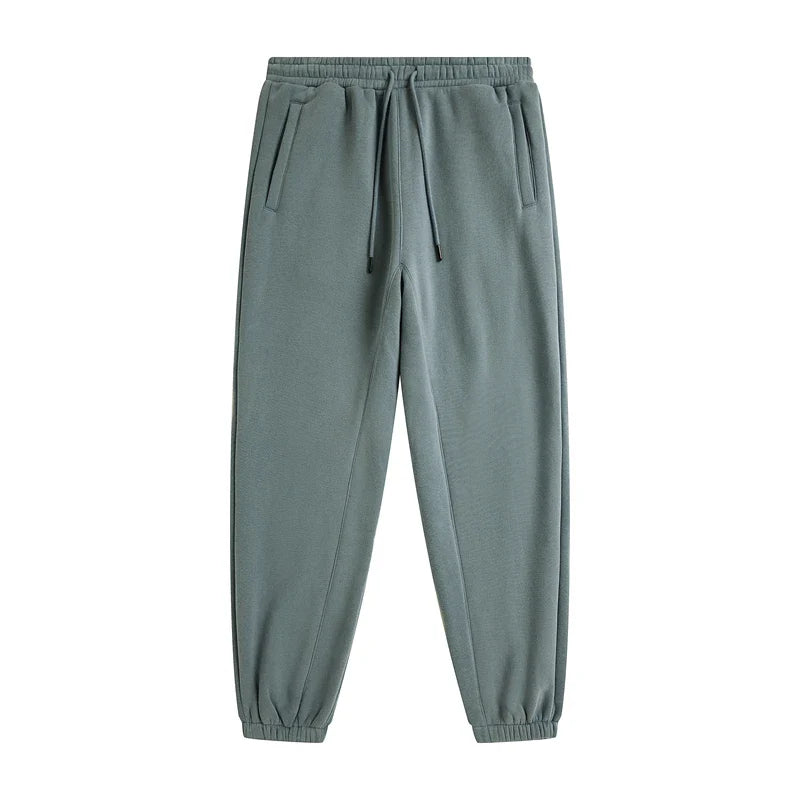 A pair of muted green zodf trendy men 345gsm fleece sweatpant with drawstring waistband and elastic cuffs in retro hip hop style