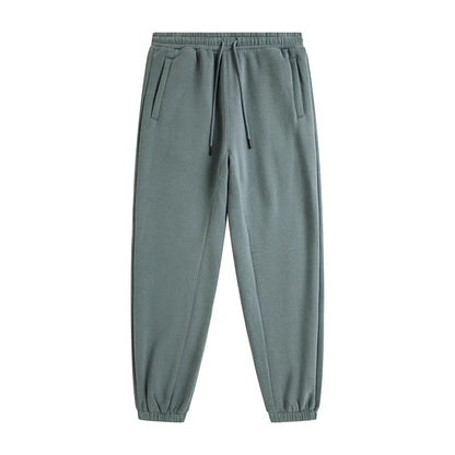 A pair of muted green zodf trendy men 345gsm fleece sweatpant with drawstring waistband and elastic cuffs in retro hip hop style