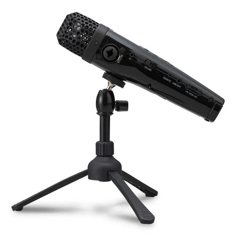 Black condenser microphone with perforated grille and knobs on tripod stand for zoom m4 portable with float recording and timecode generator